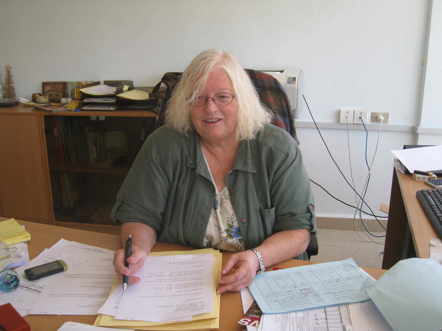 Wendy Botham at work at her desk at Petra Moon in Wadi Musa. (Photo courtesy of Petra Moon Tourism Services.)