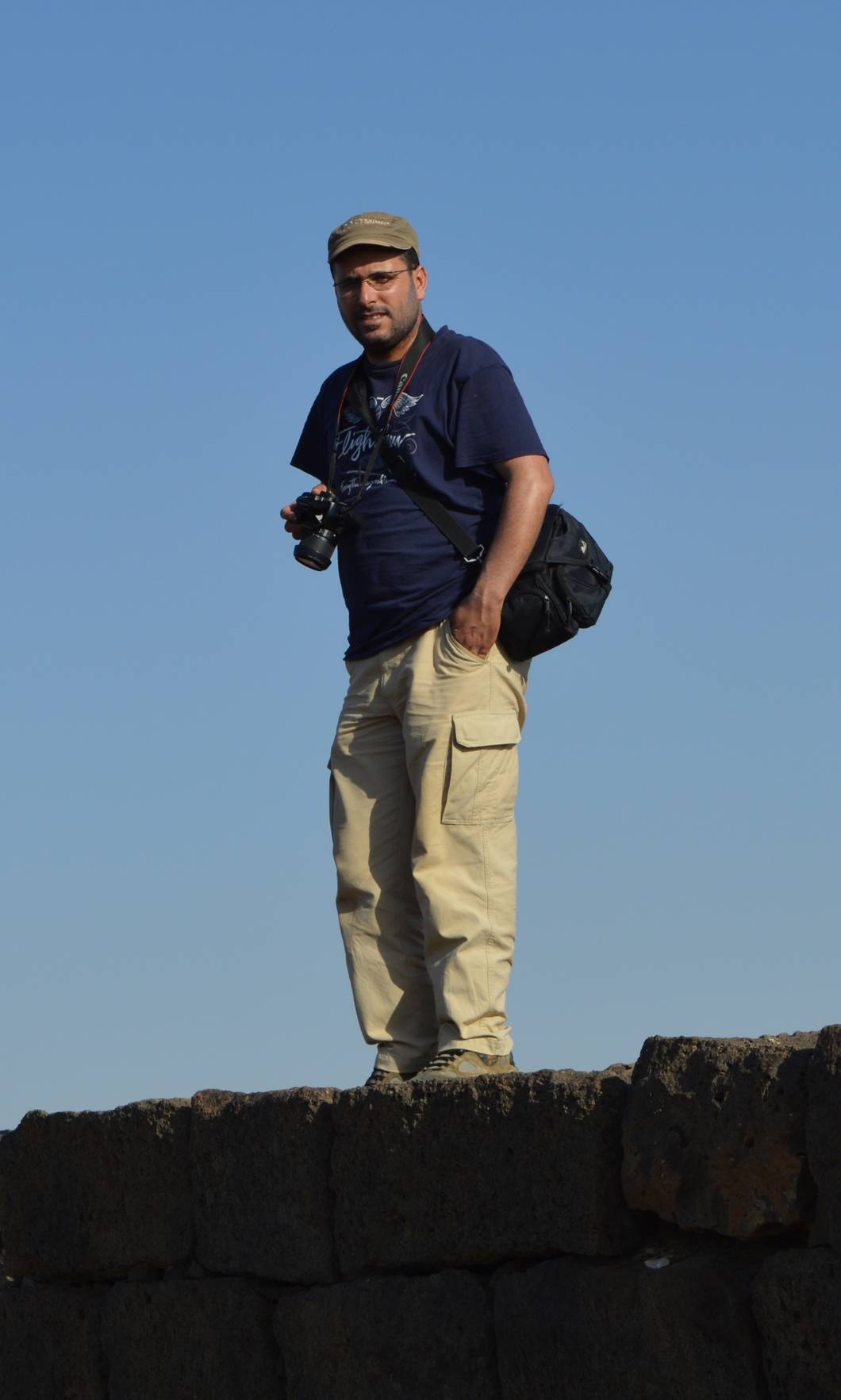 Zakariya observing the ruins of the Umayyad site of Usaykhim, north of Azraq. Photo by Ahmad Thahir.