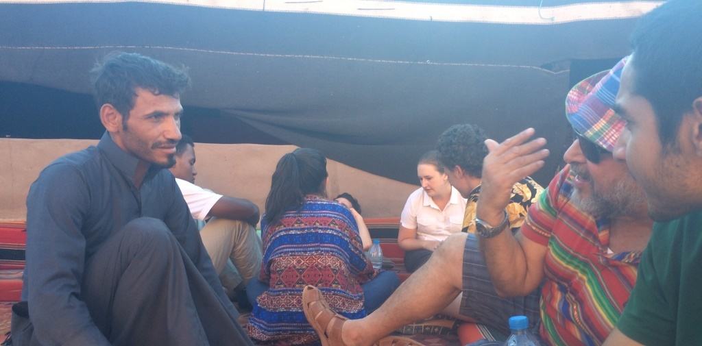 A Bedouin guide in Wadi Rum interacting with the Georgetown group at the Rainbow campsite. 