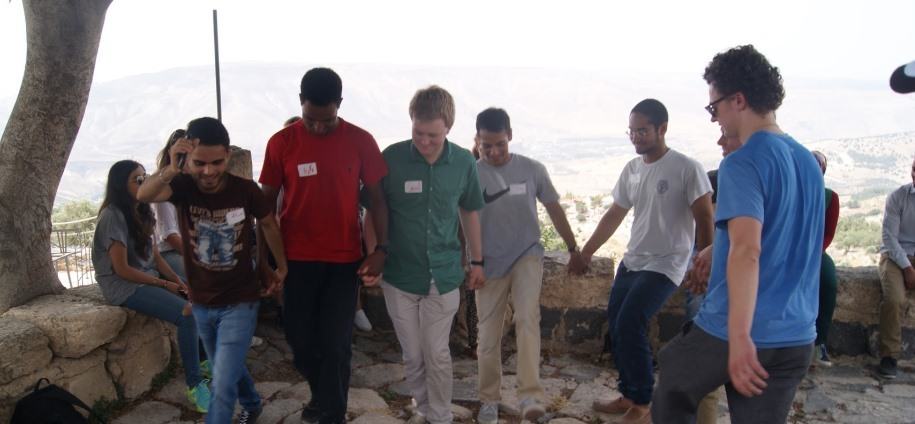 Georgetown students dance dabke during a visit of Umm Qays with young Syrian refugees. 27 June 2015. Photo credit. IRD Jordan