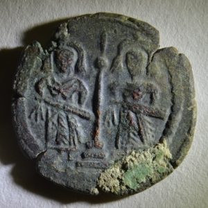 Arab-Byzantine coin from a coin hoard found in a house destroyed by an earthquake in Gerasa. Photo courtesy of the Danish-German Northwest Quarter Project, 2014