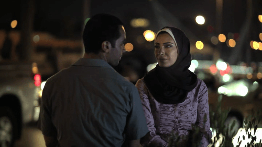 Hamdi and Monaliza sit at Abdoun Circle, a scene from the 2012 Jordanian film "When Monaliza Smiled"